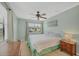 Bright bedroom with carpet, ceiling fan, and large windows, offering comfortable living space at 14454 Worthwhile Rd, Port Charlotte, FL 33953