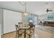 Comfortable dining area adjacent to the living room, perfect for casual meals and entertaining at 14454 Worthwhile Rd, Port Charlotte, FL 33953