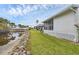 Well-maintained home with a screened-in porch and canal view, perfect for relaxing outdoors at 14454 Worthwhile Rd, Port Charlotte, FL 33953