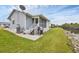 Attractive home exterior with canal access, patio, grill, and peaceful waterfront living at 14454 Worthwhile Rd, Port Charlotte, FL 33953