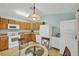Bright kitchen and dining area with modern appliances and a glass table with seating at 14454 Worthwhile Rd, Port Charlotte, FL 33953
