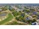Panoramic aerial view featuring a golf course community, lush landscaping, and waterway views at 16 Pine Valley Ct, Rotonda West, FL 33947