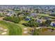 Aerial shot overlooking a golf course community, with luxurious homes by a golf course and waterway at 16 Pine Valley Ct, Rotonda West, FL 33947