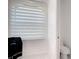 Modern bathroom with privacy window blind and toilet at 16 Pine Valley Ct, Rotonda West, FL 33947