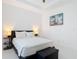 Bright bedroom with a comfortable bed and stylish decor at 16 Pine Valley Ct, Rotonda West, FL 33947