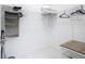 Walk in closet with open storage, rack, and custom white wire shelving system at 16 Pine Valley Ct, Rotonda West, FL 33947