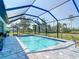 Enjoy sunny days in this private screened pool surrounded by brick pavers and views of the golf course at 16 Pine Valley Ct, Rotonda West, FL 33947