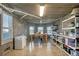 Functional basement with a dining table, storage shelves, and a chest freezer at 1953 Georgia Ave, Englewood, FL 34224