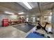 Finished basement with exercise equipment, including weights, bench, and cardio machines at 1953 Georgia Ave, Englewood, FL 34224