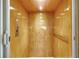 A light-colored wood-paneled elevator at 1953 Georgia Ave, Englewood, FL 34224