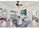Relaxing living room that has neutral tones, tile flooring, and view to the outdoor pool area at 1953 Georgia Ave, Englewood, FL 34224