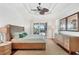 Spacious main bedroom features a ceiling fan and sliding glass doors to the screened-in lanai at 1953 Georgia Ave, Englewood, FL 34224