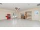 Large, bright bonus room features double doors to the backyard and ample space for storage and activities at 2140 Carnac St, Port Charlotte, FL 33952