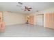 Spacious bonus room with tile floors, ceiling fan, and closets offering ample storage solutions throughout at 2140 Carnac St, Port Charlotte, FL 33952