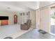 Inviting living room featuring tiled flooring, a comfortable recliner, and ample natural light at 2140 Carnac St, Port Charlotte, FL 33952