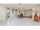 Bright living room with tile floors, neutral walls, and an abundance of natural light at 2140 Carnac St, Port Charlotte, FL 33952