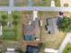 Aerial view showcases property's layout in relation to neighboring homes and street access at 23347 Lehigh Ave, Port Charlotte, FL 33954