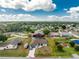 High angle aerial showcasing the property's pool, shed, and proximity to surrounding amenities at 23347 Lehigh Ave, Port Charlotte, FL 33954