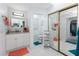 Bright bathroom features a granite vanity, toilet, and mirror-door closet at 23347 Lehigh Ave, Port Charlotte, FL 33954