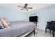 Bedroom with ceiling fan, window, and television at 23347 Lehigh Ave, Port Charlotte, FL 33954