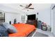 Bedroom featuring ceiling fan, television, and a window seat at 23347 Lehigh Ave, Port Charlotte, FL 33954