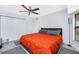 Bedroom featuring ceiling fan, gray floors, and sliding closet doors at 23347 Lehigh Ave, Port Charlotte, FL 33954
