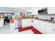 View of kitchen featuring white cabinets, granite countertops, and stainless steel appliances at 23347 Lehigh Ave, Port Charlotte, FL 33954