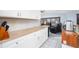 Kitchen view of butcher block countertops, white cabinets, and stainless steel dishwasher at 23347 Lehigh Ave, Port Charlotte, FL 33954