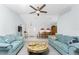 Comfortable living room featuring vaulted ceiling, ceiling fan, and decorative coffee table at 23347 Lehigh Ave, Port Charlotte, FL 33954
