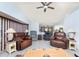 Spacious living room with vaulted ceiling, ceiling fan, and an open layout leading to other parts of the house at 23347 Lehigh Ave, Port Charlotte, FL 33954
