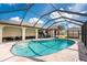 Backyard pool with a screened enclosure, patio, and outdoor seating at 23347 Lehigh Ave, Port Charlotte, FL 33954