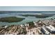Wide aerial view of a waterfront community with residential homes, lush vegetation and beach access at 2450 N Beach Rd # 231, Englewood, FL 34223