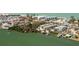 Stunning waterfront property featuring tropical landscaping, a community pool, and private boat docks at 2450 N Beach Rd # 231, Englewood, FL 34223