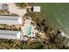 Waterfront property with private docks, lush landscaping, an outdoor pool, and access to the bay at 2450 N Beach Rd # 231, Englewood, FL 34223