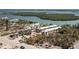 Beautiful waterfront property featuring multiple buildings surrounded by lush palm trees at 2450 N Beach Rd # 231, Englewood, FL 34223