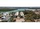 Aerial view of new two-story condos in a waterfront community with lush landscaping, and gulf access at 2450 N Beach Rd # 231, Englewood, FL 34223