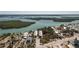 Aerial view of new two-story condos in a waterfront community with lush landscaping, and gulf access at 2450 N Beach Rd # 231, Englewood, FL 34223
