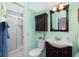 Updated bathroom with a modern vanity, toilet, and walk-in shower at 2450 N Beach Rd # 231, Englewood, FL 34223