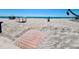 Beautiful beach access to white sand, serene ocean views, and table/chair sets at 2450 N Beach Rd # 231, Englewood, FL 34223