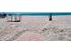 Easy beach access leads to a scenic shoreline with lounge chairs and clear ocean views at 2450 N Beach Rd # 231, Englewood, FL 34223