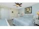 Comfortable bedroom with a ceiling fan, and neutral tones create a relaxing atmosphere at 2450 N Beach Rd # 231, Englewood, FL 34223