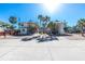 Two-story condo building with well-maintained landscaping and palm trees at 2450 N Beach Rd # 231, Englewood, FL 34223