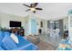 Dining area with a table, white wicker chairs, and slider to outdoor patio at 2450 N Beach Rd # 231, Englewood, FL 34223