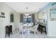 Bright dining area with seating for four, pendant lighting, and tile flooring at 2450 N Beach Rd # 231, Englewood, FL 34223