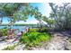 Picturesque dock with gazebo overlooking serene water and lush mangroves, perfect for waterfront enjoyment and relaxation at 2450 N Beach Rd # 231, Englewood, FL 34223