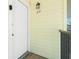 Apartment entrance featuring a white door, lantern, and unit number 231 at 2450 N Beach Rd # 231, Englewood, FL 34223