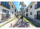 Condo complex featuring manicured lawns, walkways, and tropical trees, creating an inviting, lush atmosphere at 2450 N Beach Rd # 231, Englewood, FL 34223