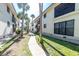 Condo community featuring lush greenery, sidewalks, and well-maintained exteriors, blending comfort with outdoor living at 2450 N Beach Rd # 231, Englewood, FL 34223