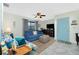 Comfortable living room with tile floors, ceiling fan, and bright-colored sofas at 2450 N Beach Rd # 231, Englewood, FL 34223