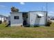 Exterior view of home with yard; ideal for enjoying outdoor activities and relaxation at 248 Outer E Dr, Venice, FL 34285
